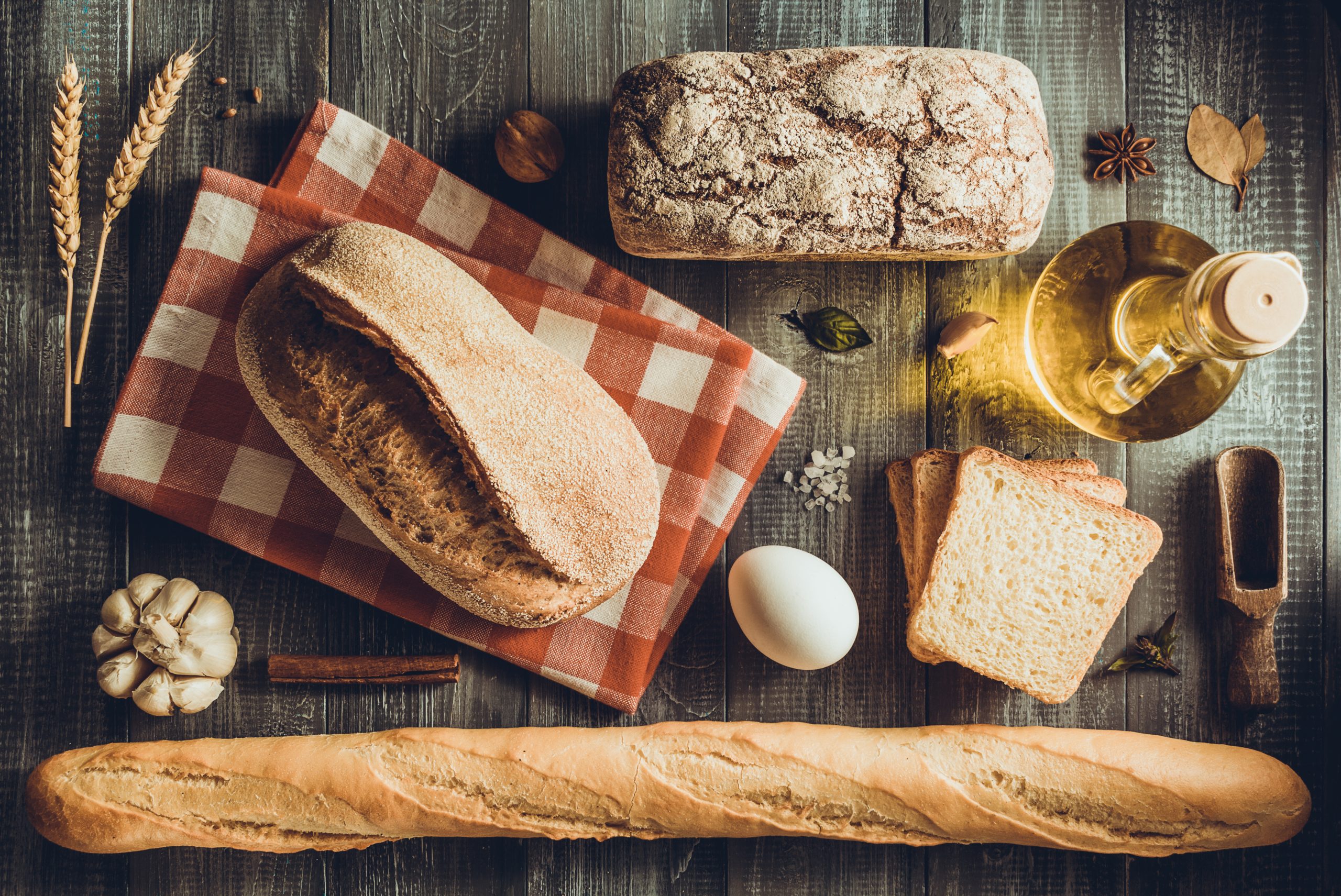 bread and bakery products on wood background